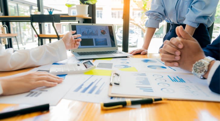 Real estate investors meet to discuss a potential investment opportunity. 